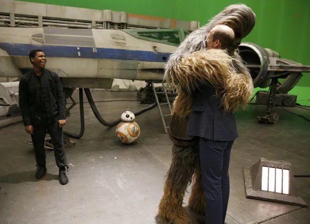 Britain's Prince William is hugged by Chewbacca as British actor John Boyega smiles during a tour of the Star Wars sets at Pinewood studios in Iver Heath, west of London, Britain on April 19, 2016. (Photo by Adrian Dennis/Reuters)