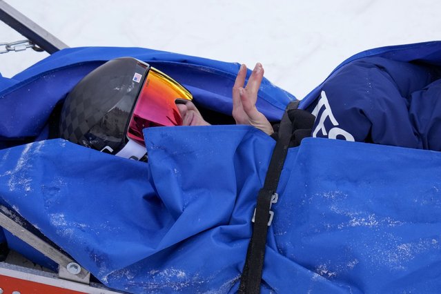 Nina O'Brien of United States is taken on stretcher after falling during the women's giant slalom at the 2022 Winter Olympics, Monday, February 7, 2022, in the Yanqing district of Beijing. (Photo by Luca Bruno/AP Photo)