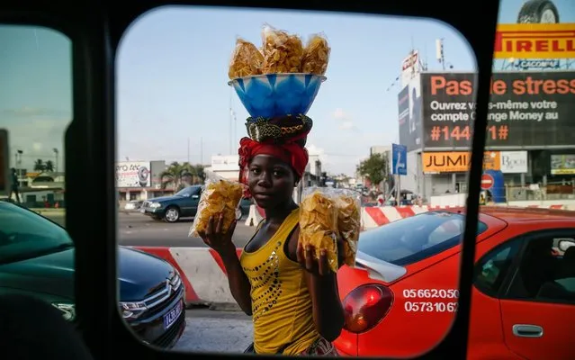 A woman sells chips in Abidjan, Ivory Coast on August 09, 2019. World's number one cacao producer Ivory Coast's capital Abidjan set peace after the 201011 Ivorian crisis. Women in Abidjan work in various jobs to help their families' budget. (Photo by Mahmut Serdar Alakus/Anadolu Agency via Getty Images)