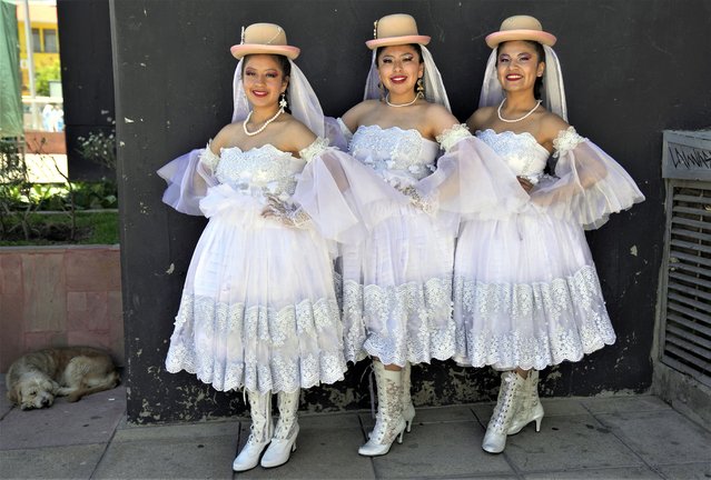 Women dressed as brides pose for a photo before the wedding of Pepino, a Carnival character, in La Paz, Bolivia, Sunday, February 12, 2023. The parody wedding ceremony is part of pre-Carnival celebrations. (Photo by Juan Karita/AP Photo)