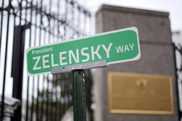 A sign that reads “President ZELENSKY WAY” is seen in front of the Embassy of Russian Federation, Monday, March 7, 2022 in Washington. (Photo by Carolyn Kaster/AP Photo)