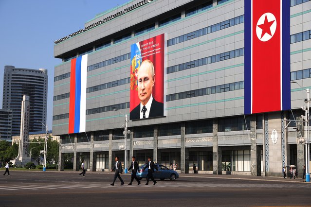 A picture of Russia's President Vladimir Putin on a billboard is seen on a buildingon June 18, 2024, in Pyongyang, North Korea. Russian President Vladimir Putin is arriving to North Korea with a two-day visit. (Photo by Contributor/Getty Images)