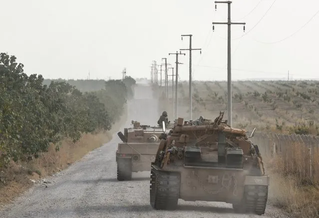A Turkish army tank moves towards the Syrian border on October 18, 2019 in Ceylanpinar, Turkey. Turkish forces appeared to continue shelling targets in Northern Syria despite yesterday's announcement, by U.S. Vice President Mike Pence, that Turkey had agreed to a ceasefire in its assault on Kurdish-held towns near its border. (Photo by Burak Kara/Getty Images)