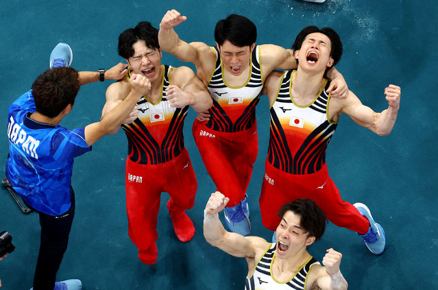 Wataru Tanigawa of Japan, Kazuma Kaya of Japan, Shinnosuke Oka of Japan, and Takaaki Sugino of Japan react after teammate Daiki Hashimoto of Japan landed his horizontal bar routine during the team's gold medal win in the Artistic Gymnastics Mens Team Final at the Bercy Arena during the Paris 2024 Summer Olympic Games on July 29th, 2024 in Paris, France. (Photo by Athit Perawongmetha/Reuters)