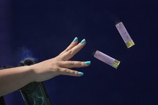 Britain's Amber Jo Rutter ejects empty cartridges from her gun as she competes in the Skeet women's final at the 2024 Summer Olympics, Sunday, August 4, 2024, in Chateauroux, France. (Photo by Manish Swarup/AP Photo)