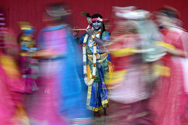 A college student dressed in the guise of Hindu deity Krishna, ahead of Janmashtami festival, in Chennai on August 23, 2024. (Photo by R.Satish Babu/AFP Photo)