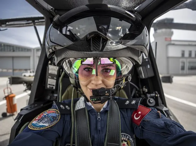 Pilot Commissioner Ozge Karabulut prepares to take off during World Pilots Day in Ankara, Turkiye on April 25, 2022. Pilot Commissioner Ebru Melek (not seen) who has been involved in the fight against criminals, especially terrorism, within the body of the Aviation Department of the General Directorate of Security, which has ensured peace and security in the skies of the homeland for 41 years with aircraft, of Turkish Police Service and Turkiye's the first female attack helicopter Pilot Commissioner Ozge Karabulut celebrate her colleagues World Pilots' Day on April 26th. (Photo by Aytac Unal/Anadolu Agency via Getty Images)