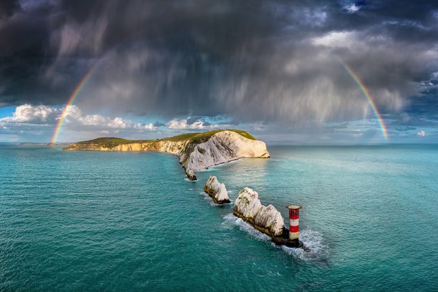 A rainbow cuts through a squall above The Needles, the Isle of Wight, on Tuesday evening, April 16, 2024. (Photo by Jamie Russell/IslandVisions via BNPS)