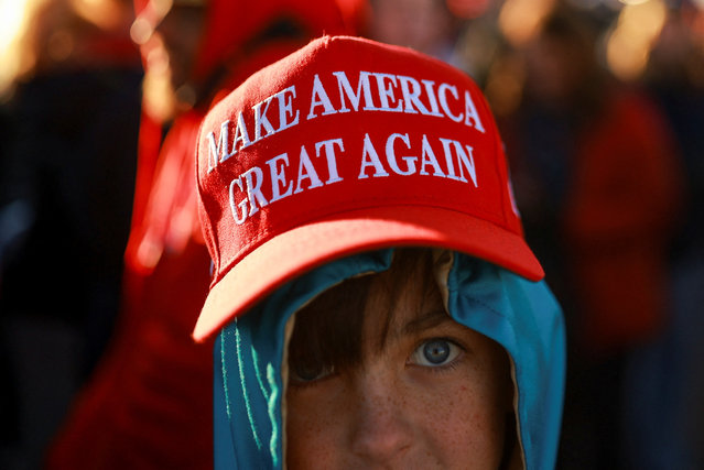 A boy wears a MAGA hat on the day Donald Trump attends a campaign rally in Albuquerque, New Mexico on October 31, 2024. (Photo by Jose Luis Gonzalez/Reuters)