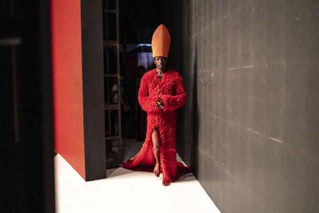 A model wearing a creation by Nigerian designer Oshobor enters the catwalk during the Lagos Fashion Week on October 24, 2024. (Photo by Olympia de Maismont/AFP Photo)