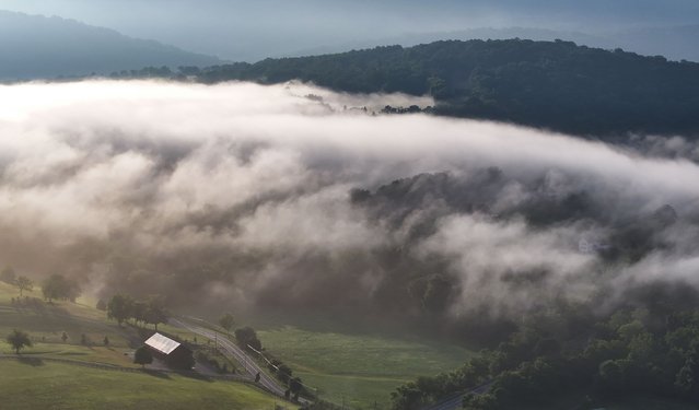 Layers of fog blanket the valley following a night of thunderstorms on July 31, 2024 in Myersville, Md. (Photo by Ricky Carioti/The Washington Post)