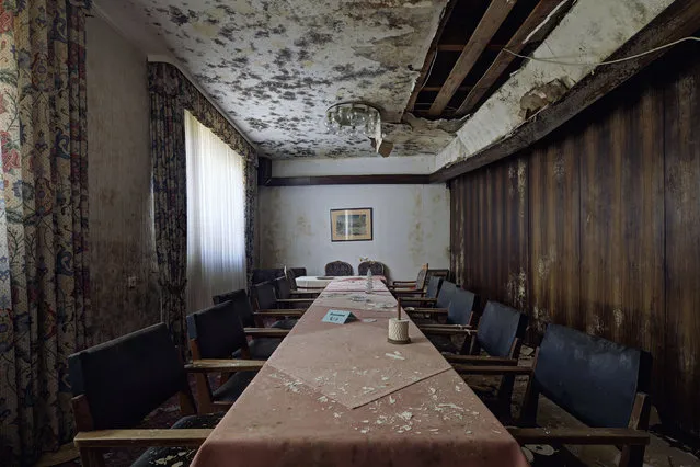 Main dining table – Burnt out hotel. (Photo by Daniel Barter/Caters News)