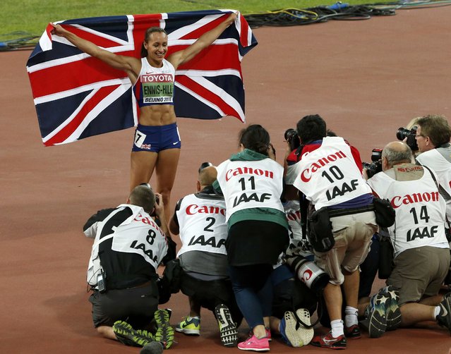 Jessica Ennis-Hill of Britain poses for photographers as she celebrates winning the women's heptathlon during the 15th IAAF World Championships at the National Stadium in Beijing, China August 23, 2015. (Photo by David Gray/Reuters)