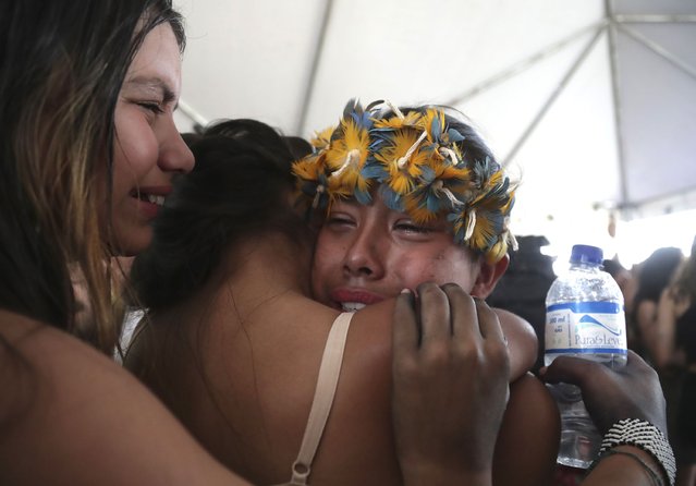 Indigenous women embrace as they celebrate a Supreme Court ruling to enshrine Indigenous land rights, in Brasilia, Brazil, Thursday, September 21, 2023. Six of the 11 Supreme Court justices voted against establishing a cut-off date after which Indigenous peoples could not claim new territory. (Photo by Gustavo Moreno/AP Photo)