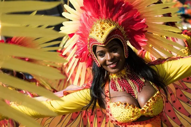 A reveller takes part in the Notting Hill Carnival in London, Britain, 28 August 2017. The street festival celebrates its 51st anniversary and more than a million people are expected to attend on 27 and 28 August. (Photo by Will Oliver/EPA/EFE)