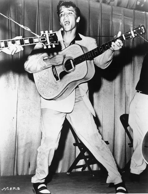 This is a 1956 photo of Elvis Presley performing.  This photo was used for his first RCA Victor album cover. (Photo by AP Photo)