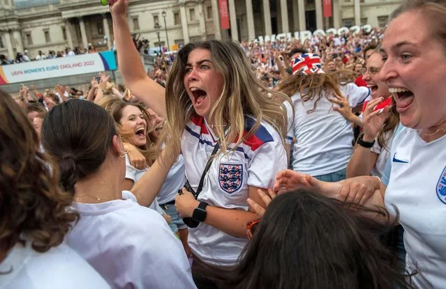 England football fans celebrate in Trafalgar Square as England score their second goal during extra time in the UEFA Euro womens championship final on July 31, 2022 in London, United Kingdom. England take on Germany in the final of The UEFA European Women's Championship, played at Wembley Stadium. (Photo by Chris J Ratcliffe/Getty Images)