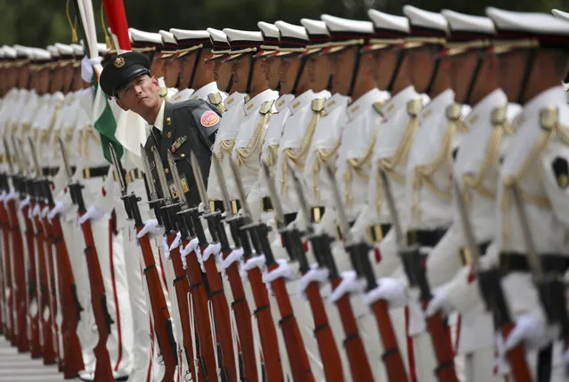 Japanese honor guard members prepare for inspection bythe  Indian Defense Minister Arun Jaitley at the Defense Ministry in Tokyo Tuesday, September 5, 2017. (Photo by Eugene Hoshiko/AP Photo)