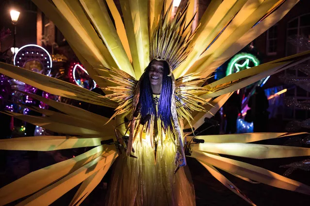 Performers prepare to take part in the Illuminated Night Carnival Parade which features in the annual “Light Night Leeds” festival of visual arts in the centre of Leeds, northern England on October 5, 2017. The festival features projections, interactive installations, exhibitions, dance, music and street performances taking place in the centre of the city. (Photo by Oli Scarff/AFP Photo)