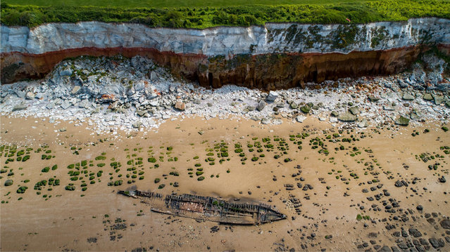 The wreck of the Sheraton appears at low tide in Hunstanton, England on May 4, 2020. Between 1915 and 1918 the trawler was used during boom defence work and in the second world war it served as a patrol vessel. In 1945 it became a target ship, before being wrecked in 1947. In 2004 the wreck was 38.5m long by 5.35m wide, with a substantial section of the metal hull surviving. (Photo by Terry Harris/Rex Features/Shutterstock)