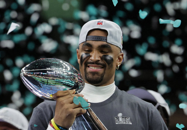 Philadelphia Eagles' Jalen Hurts celebrates with the Vince Lombardi Trophy after winning Super Bowl LIX of the NFL Super Bowl 59 football game between the Kansas City Chiefs and the Philadelphia Eagles, Sunday, February 9, 2025, in New Orleans. (Photo by Mike Segar/Reuters)