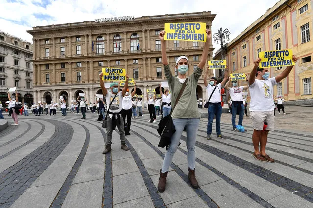 Healthcare workers hold placards reading 'respect for nurses' during a flash mob outside the palace of the Liguria region government, Genoa, Italy, 08 June 2020. Countries around the world have started to ease COVID-19 lock-down restrictions in an effort to restart their economies and help people in their daily routines after the outbreak of coronavirus pandemic. (Photo by Luca Zennaro/EPA/EFE/Rex Features/Shutterstock)