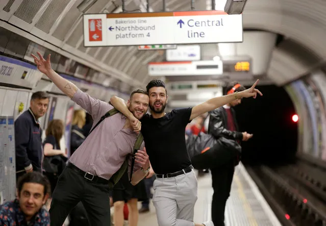 Passengers pose for a photograph as they wait for the Night Tube train service at Oxford Circus on the London underground system in London, Britain August 20, 2016. (Photo by Paul Hackett/Reuters)