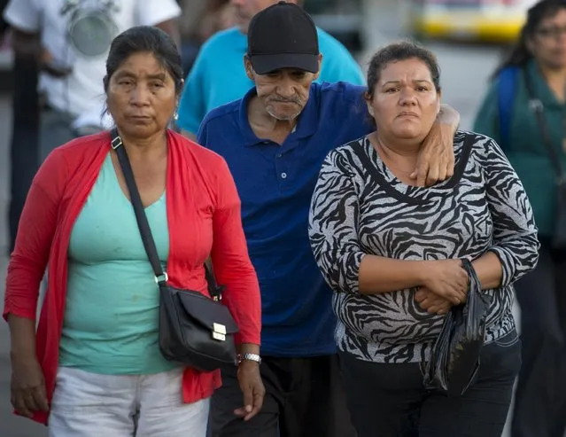 People make their way along a street in the border town of San Ysidro, California September 3, 2015. (Photo by Mike Blake/Reuters)