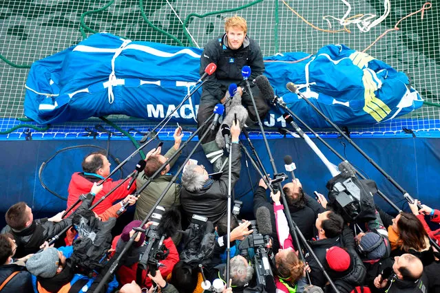 French skipper Francois Gabart answers journalists' questions upon his arrival at the end of his solo around the world navigation, on December 17, 2017 in Brest, western France. Frenchman Francois Gabart smashed the world record for the fastest solo navigation of the globe, in 42 days, 16 hours, 40 minutes and 35 seconds. (Photo by Damien Meyer/AFP Photo)