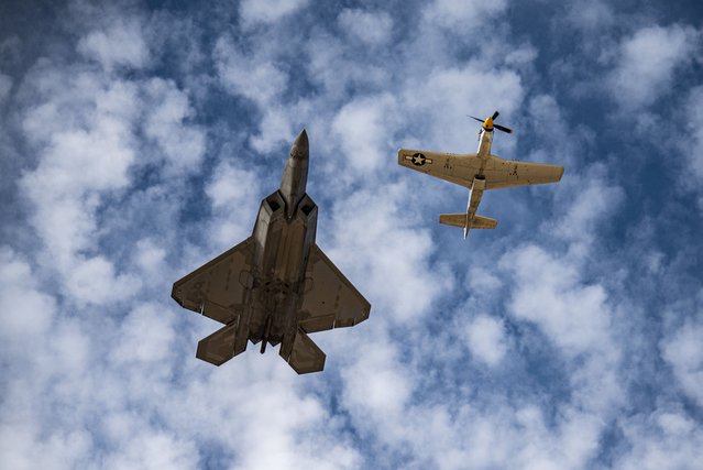 U.S. Air Force Maj. Joshua “Cabo” Gunderson, F-22 Raptor Demonstration Team pilot and commander, flies in formation with a P-51 Mustang during the 2022 Heritage Flight Training Course at Davis-Monthan Air Force Base, Arizona, on March 3, 2022. During the course, aircrew practice ground and flight training to enable civilian pilots of historic military aircraft and U.S. Air Force pilots of current fighter aircraft to fly safely in formations together. The HFTC is also intended to certify air show pilots for the upcoming air show season. (U.S. Air Force photo by Senior Airman Alex Miller)