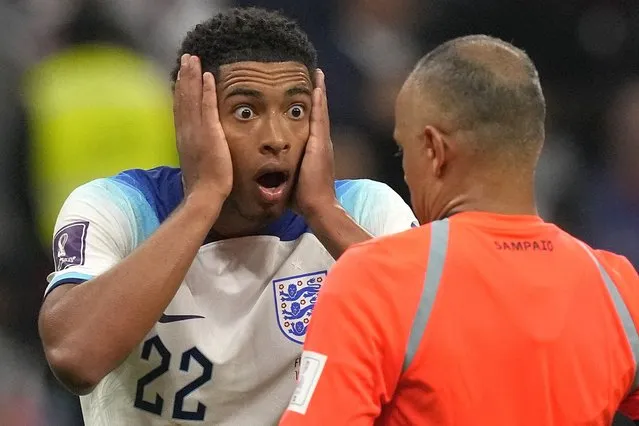 England's Jude Bellingham reacts in front of referee Wilton Sampaio during the World Cup quarterfinal soccer match between England and France, at the Al Bayt Stadium in Al Khor, Qatar, Saturday, December 10, 2022. (Photo by Frank Augstein/AP Photo)