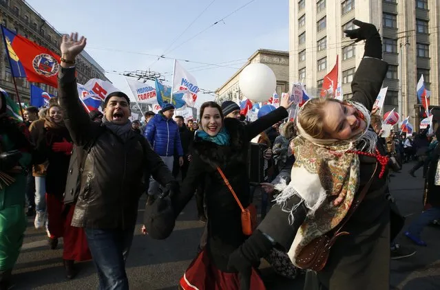 People dance as they attend a demonstration on National Unity Day in Moscow November 4, 2014. Russia marks National Unity Day on November 4 to celebrate the defeat of Polish invaders in 1612. (Photo by Sergei Karpukhin/Reuters)