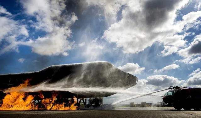 A demonstration of the fire department during the “Super Neighbours Days” at Schiphol Airport, Amsterdam, The Netherlands, 18 September 2016. Residents of the Schiphol area are invited to celebrate the the 100th anniversary of the airport. (Photo by Koen van Weel/EPA)