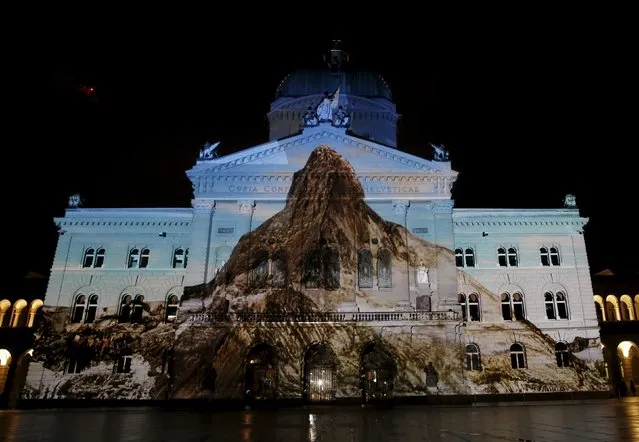 The Swiss Federal Palace (Bundeshaus) is illuminated by giant light projection "The Jewel of the Mountains" in Bern, Switzerland October 15, 2015. The light and sound show will run every evening until November 29, 2015. (Photo by Ruben Sprich/Reuters)