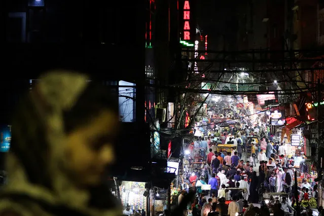 People are seen in a crowded street amidst the spread of the coronavirus disease (COVID-19), in the old quarters of Delhi, India, September 13, 2020. (Photo by Anushree Fadnavis/Reuters)