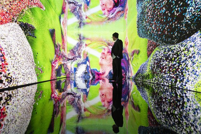 The digital artwork installation “Living Memory: Messi – A Goal in Life” by artist Refik Anadol during an auction press preview at Christie’s in New York, New York, USA, 11 July 2025. Anadol collaborated with Lionel Messi, using AI techniques to transform Messi’s thoughts and emotions about one of his iconic goals into an immersive artwork. The work is being auctioned online until 22 July 2025, with proceeds benefiting multiple charitable organizations. (Photo by Justin Lane/EPA)