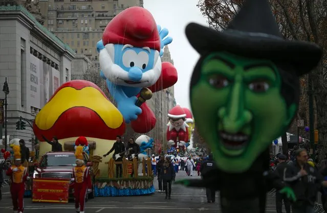 Balloons float down Central Park West during the 88th Macy's Thanksgiving Day Parade in New York November 27, 2014. (Photo by Eduardo Munoz/Reuters)