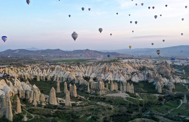 Cappadocia, which attracts the attention of local and foreign tourists with its fairy chimneys hot air balloons as well as rock-carved historical sites, hosts millions of visitors every year in Nevsehir, Turkiye on April 22, 2025. TheCappadocia, which is considered the center of hot air ballooning in terms of flight days and number of passengers in the world, receives 4 million 765 thousand 240 tourists with balloon tours in the last 10 years. (Photo by Behcet Alkan/Anadolu via Getty Images)