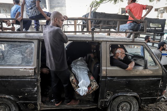 People attend funerals after the bodies of Palestinians who lost their lives are brought to Al-Shifa Hospital for a funeral ceremony following the Israeli army attacked Palestinians gathered for aid in the Zikim area in northern Gaza Strip, resulting in deaths and injuries, on August 15, 2025 in Gaza City, Gaza. (Photo by Saeed M. M. T. Jaras/Anadolu via Getty Images)