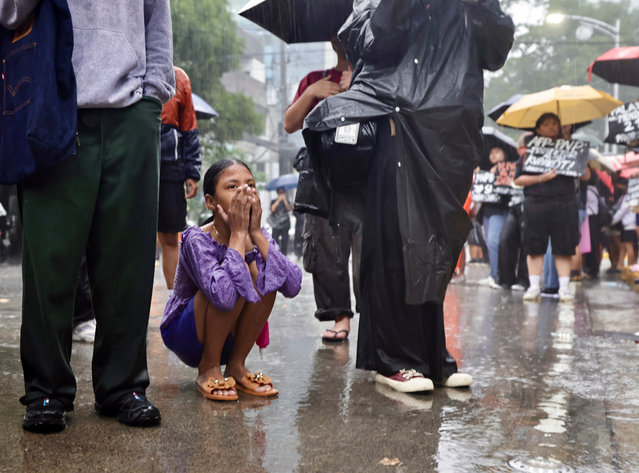 A relative of detained protestors views a demonstration in front of a police station in Manila, Philippines, 22 September 2025. The demonstrators called for the release of more than a hundred detained protesters from a rally in the vicinity of Malacanang presidential palace. Close to a hundred police personnel were hurt in 21 September's violent protests in Manila, the Department of the Interior and Local Government (DILG) reported on September 22. The violent protest was triggered by the discovery of corruption on government flood control projects under President Ferdinand Marcos Jr.'s administration. (Photo by Francis R. Malasig/EPA)