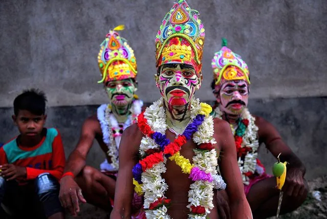 Hindu devotees posed for a photo with their painted face during the annual Gajan Festival in Bardhhaman, India on April 12, 2023. Gajan is a Hindu festival celebrated mostly in the rural part of West Bengal. Gajan spans around a week, starting mid-April. Participants of this festival are known as Sannyasi or Devotees. The central theme of this festival is deriving satisfaction through non-sеxual pain, devotion, and sacrifice. (Photo by Avishek Das/SOPA Images/Rex Features/Shutterstock)