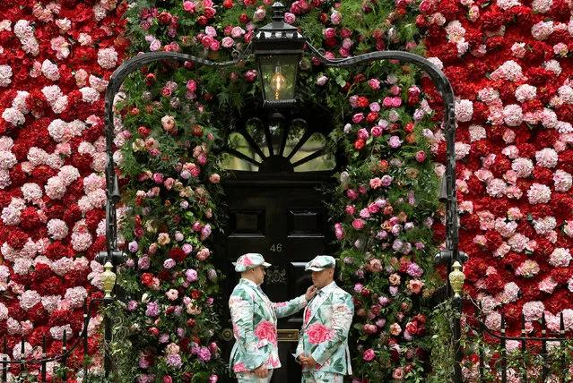 Doormen dressed in floral pattern suits stand on duty outside of Annabel's private members club, adorned with thousands of flowers, timed to coincide with the RHS Chelsea Flower Show, in Mayfair in London, Britain, May 24, 2018. (Photo by Toby Melville/Reuters)