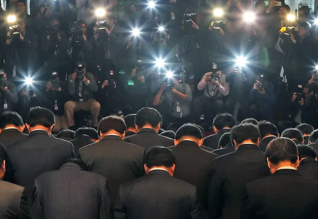 Lawmakers of the ruling South Korean Saenuri Party bow at the National Assembly building in Seoul, Sourth Korea, 04 November 2016, in a show of apology over a nation-rocking scandal involving a long-time confidante of President Park Geun-hye, which has almost paralyzed her administration. South Korean President Park Geun-Hye earlier agreed to submit to questioning by prosecutors investigating a corruption scandal engulfing her administration. (Photo by EPA/Yonhap)