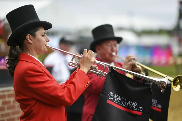 Buglers Adrienne Doctor and Jari Villanueva play a call to the post prior to the 4th race during the 148th running of the Preakness Stakes at Pimlico Race Course on May 20, 2023. (Photo by Jonathan Newton/The Washington Post)