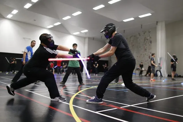 Competitors participate in a light saber duel tournament organized by the Sport Saber League in Paris, France, October 29, 2015. (Photo by Charles Platiau/Reuters)