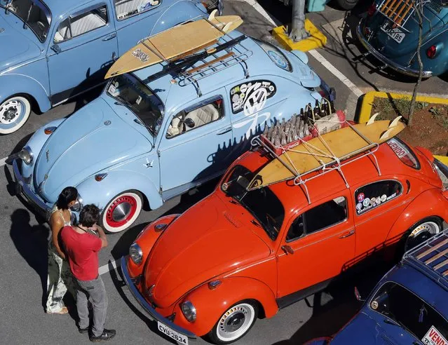 Visitora attend a Volkswagen Beetle owners' meeting in Sao Bernardo do Campo January 25, 2015. (Photo by Paulo Whitaker/Reuters)