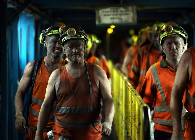 Miners react after their last shift at Kellingley Colliery on December 18, 2015 in Knottingley, England. Kellingley began production in 1965 and is the UK's last deep coal mine. Its closure will complete a carefully managed two-year plan for the UKs deep mines. This has been implemented by UK Coal with financial support from the British government. It follows a long period of difficult trading conditions largely due to low international coal prices. (Photo by Nigel Roddis/WPA Pool/Getty Images)