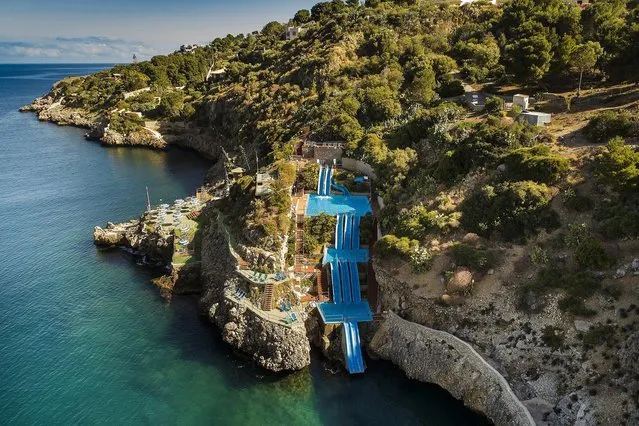 World's Greatest Swimming Pools: Hotel Villagio Citta del Mare, Terrasini PA, Italy. In this corner of Sicily, forget about the day's tourist quota and embrace your inner child by careening over Europe's tallest water slide. Constructed on the side of a cliff, the group of three pools and four slides culminates with a restorative thud into the Gulf of Castellammare. (From $156). (Photo by Vittorio Sciosia/Blumberg)