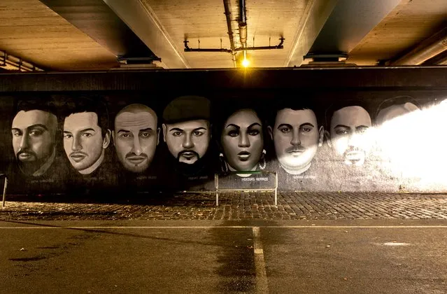 A graffiti under a bridge shows the nine victims of the Hanau shooting, in Frankfurt, Germany, Wednesday, February 17, 2021. One year ago a far right man shot nine people before he shot himself. Hanau will commemorate the victims on Friday. (Photo by Michael Probst/AP Photo)