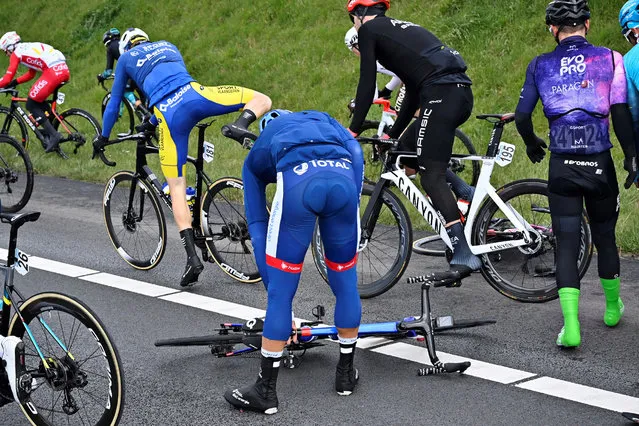 French Adrien Petit of Total Direct Energie (C) gets up after falling during the 109h edition of the “Scheldeprijs” one day cycling race, 193,8 km from Terneuzen in the Netherlands to Schoten in Belgium, on April 7 2021. (Photo by Dirk Waem/BELGA/AFP Photo)